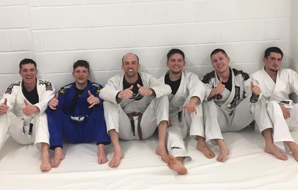 Gi Class - Coach is showing a technique